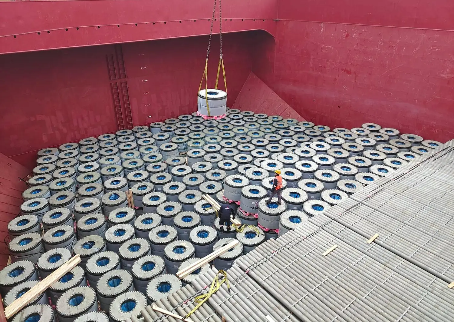 Quayside cargo operation showing compatible dry bulk parcels being managed across vessel holds.